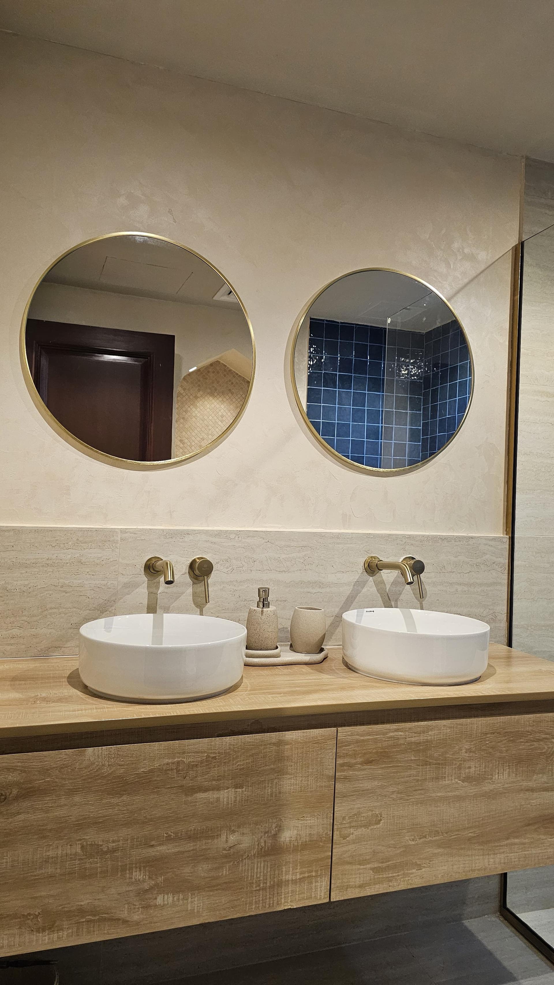 Elegant Bathroom Design with Round Backlit Mirrors