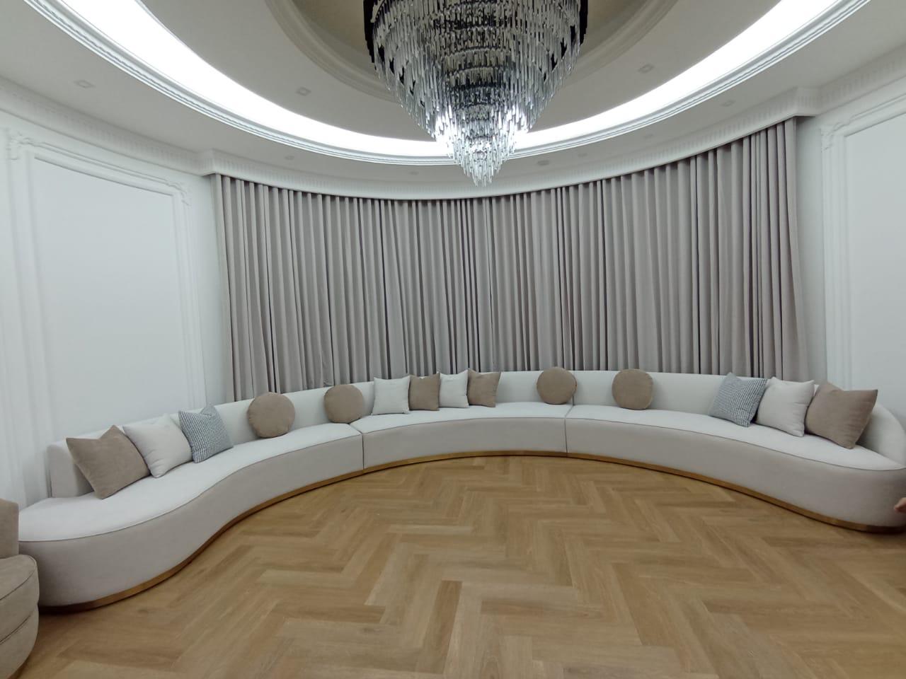 Grand Living Room with Large Curved Sectional Sofa