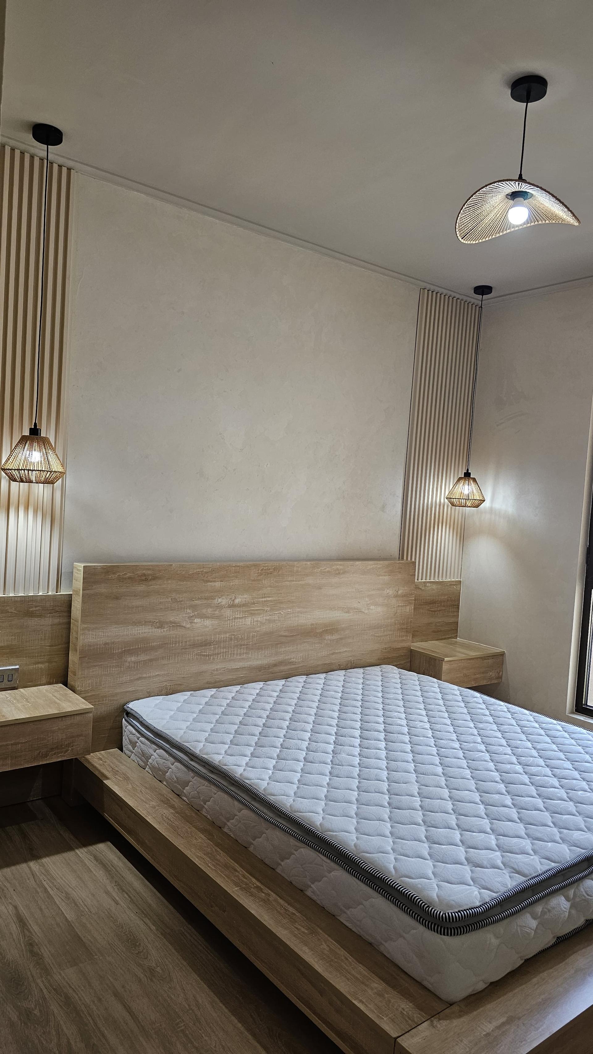 Custom Master Bed with Wood Slat Accent Wall