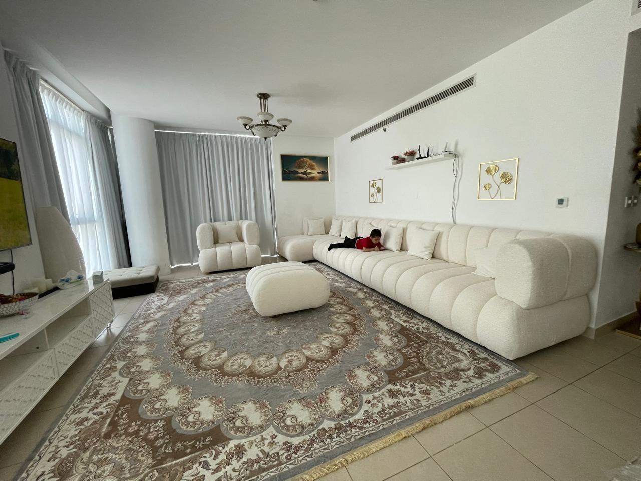 Large Living Room with White Curved Sectional Sofa